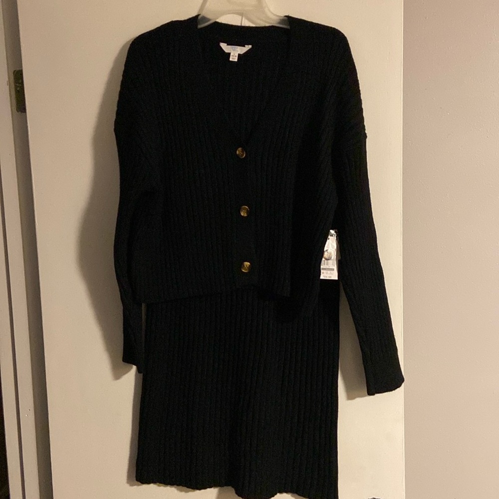 Sweater skirt set large. 12/14 in size. Black with brown buttons. Never worn.